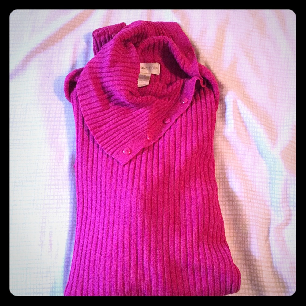 Split turtleneck can be worn buttoned or open